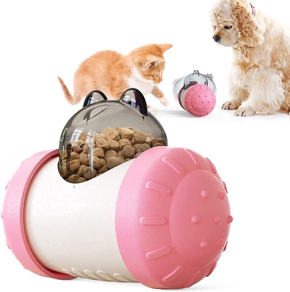 Interactive Treat-Dispensing Cat Ball — pink treat-dispensing ball filled with treats beside two cats