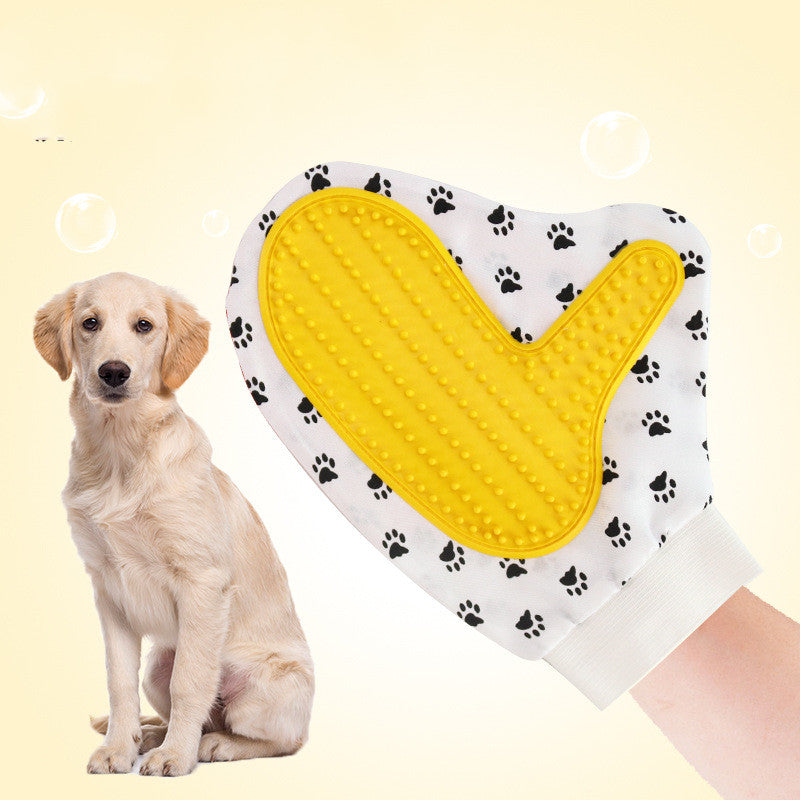 Pet Deshedding Grooming Gloves — hand wearing the yellow grooming mitt beside a sitting golden retriever puppy