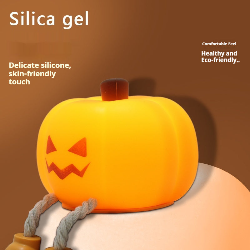 Halloween Pumpkin Silicone Night Light — glowing pumpkin with jack-o-lantern face advertising delicate silica gel with skin-friendly touch