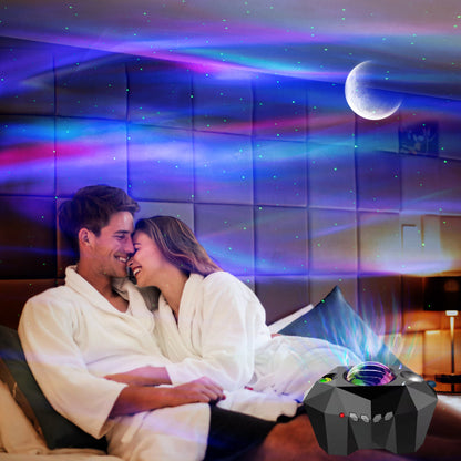 Aurora Borealis Star Projector — Northern Lights Night Light — couple relaxing in bed under aurora light projections on the wall