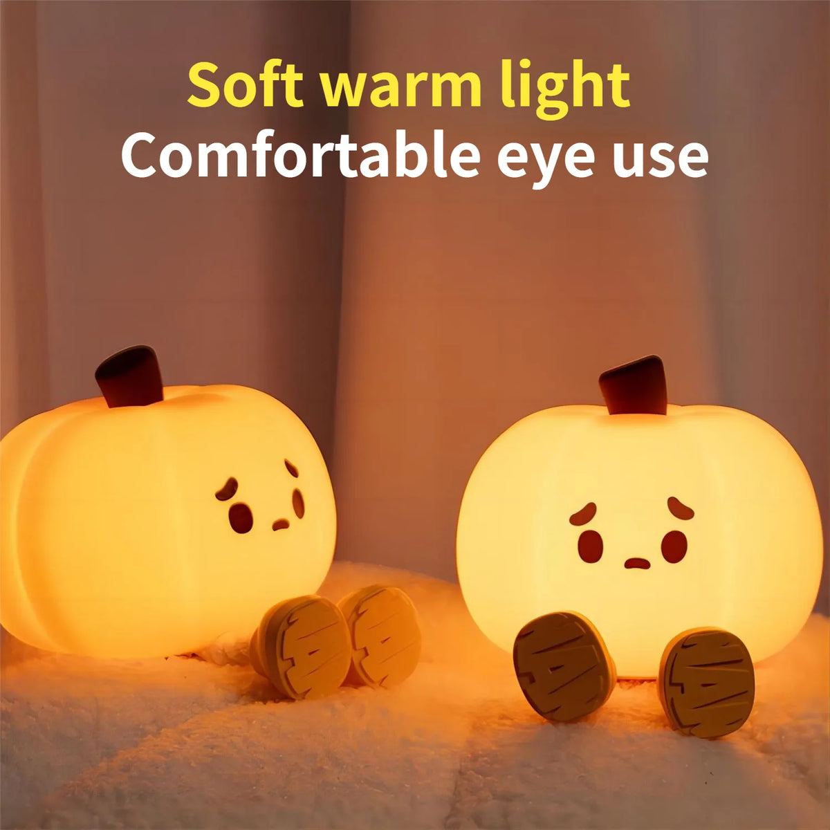 Halloween Pumpkin Silicone Night Light — two glowing pumpkins with cute sad faces on a fluffy surface, advertising soft warm light for comfortable eye use