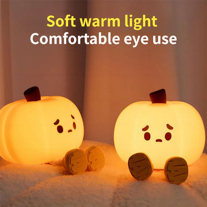 Halloween Pumpkin Silicone Night Light — two glowing pumpkins with cute sad faces on a fluffy surface, advertising soft warm light for comfortable eye use